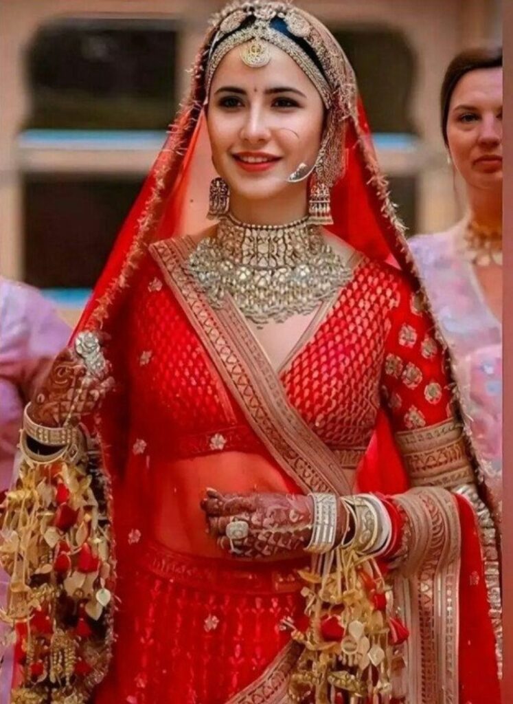 Katrina Kaif लाल लहंगे में लगीं बेहद शाही, सोशल मीडिया पर वायरल हुआ रॉयल ब्राइडल लुक 2 screenshot 20260226 094905 chatgpt6854040542663075094